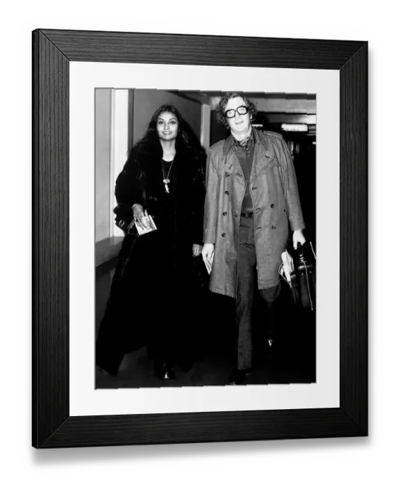Framed Print : Michael Caine actor with wife Shakira at airport - December 1972 Dbase