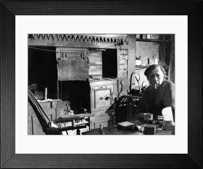 Framed Print : The Interior of slum housing in an area of Newcastle - Mr George Marshall sits in his Framed Print : The Interior of slum housing in an area of Newcastle - Mr George Marshall sits in his