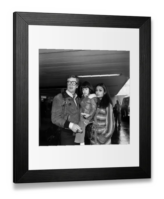 Framed Print : L. A. P. Michael Caine and Family. Actor Michael Caine and his wife Shakira leaving London