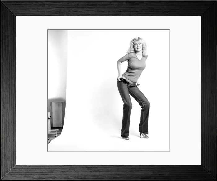 Framed Print : Fashion: Clothing: A woman pulling up a pair of denim jeans. January 1981 81-00051-001 Framed Print : Fashion: Clothing: A woman pulling up a pair of denim jeans. January 1981 81-00051-001