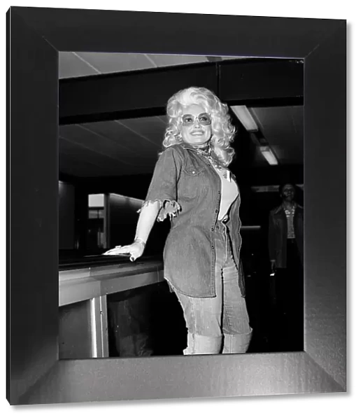 Country & Western singer Dolly Parton arrving at London Airport. 16th May 1977