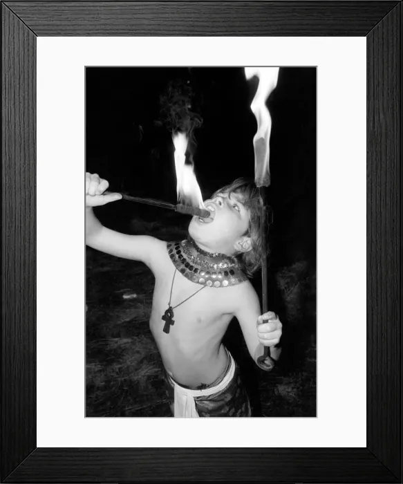 Framed Print : Unusual: Children. Fire Eater. 9 year old Tony Walls. Tony at his Fire Swallowing Act