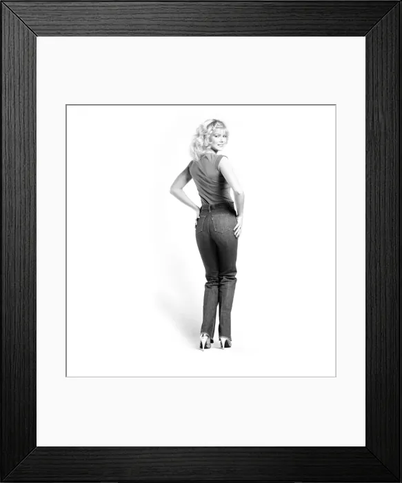 Framed Print : Fashion: Clothing: A woman pulling up a pair of denim jeans. January 1981 81-00051-008 Framed Print : Fashion: Clothing: A woman pulling up a pair of denim jeans. January 1981 81-00051-008