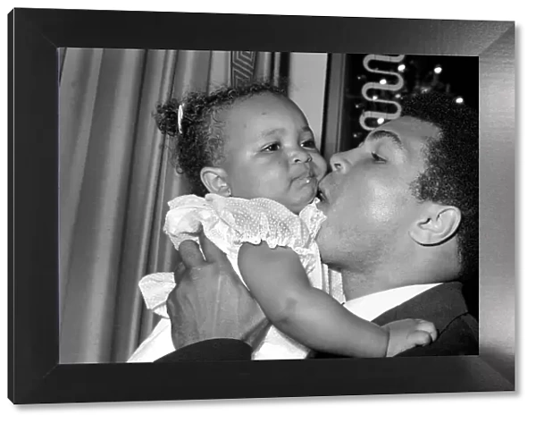 Cassius Clay. Muhammad Ali and daughter Hannah. Ali has baby sitter problems