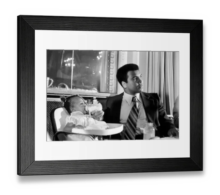 Framed Print : Cassius Clay. Muhammad Ali and daughter Hannah. Ali has baby sitter problems