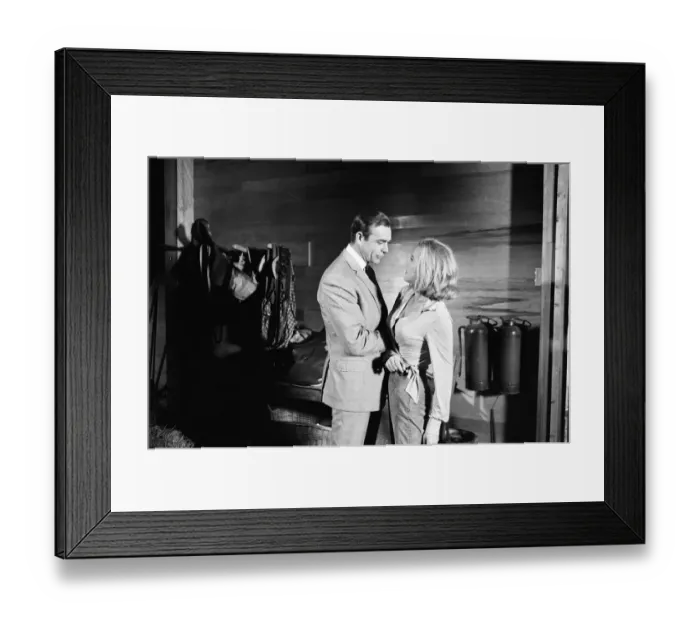 Framed Print : Honor Blackman as Pussy Galore and Sean Connery as James Bond seen here filming a fight