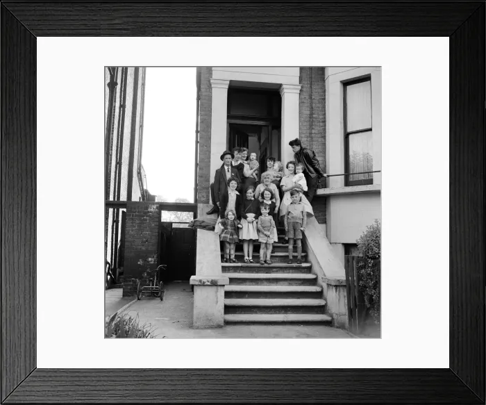 Framed Print : The O Brien family standing on the front steps outside their flat in New Cross Framed Print : The O Brien family standing on the front steps outside their flat in New Cross