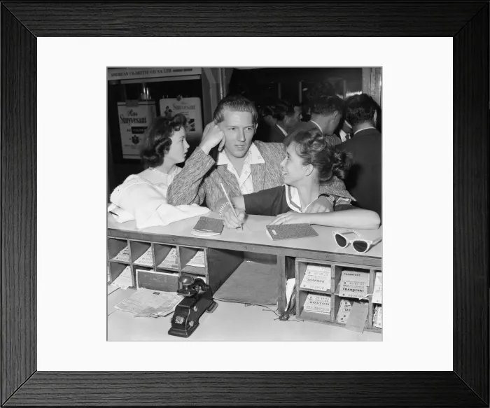 Framed Print : American rock and roll singer Jerry Lee Lewis signs immigration cards with his thirteen Framed Print : American rock and roll singer Jerry Lee Lewis signs immigration cards with his thirteen
