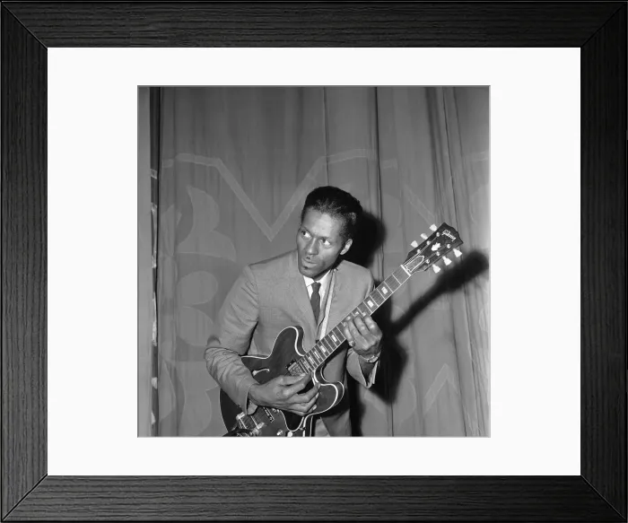 Framed Print : American rock and roll singer and musician Chuck Berry tunes up his guitar before going Framed Print : American rock and roll singer and musician Chuck Berry tunes up his guitar before going