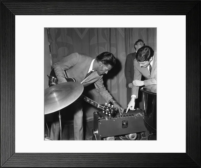 Framed Print : American rock and roll singer and musician Chuck Berry tunes up his guitar before going Framed Print : American rock and roll singer and musician Chuck Berry tunes up his guitar before going