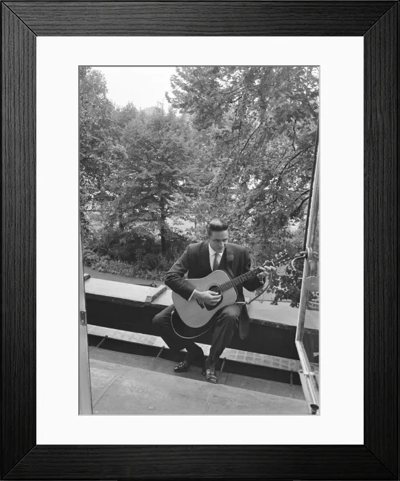 Framed Print : American country singer and musician Johnny Cash poses for photographers at the Savoy Framed Print : American country singer and musician Johnny Cash poses for photographers at the Savoy