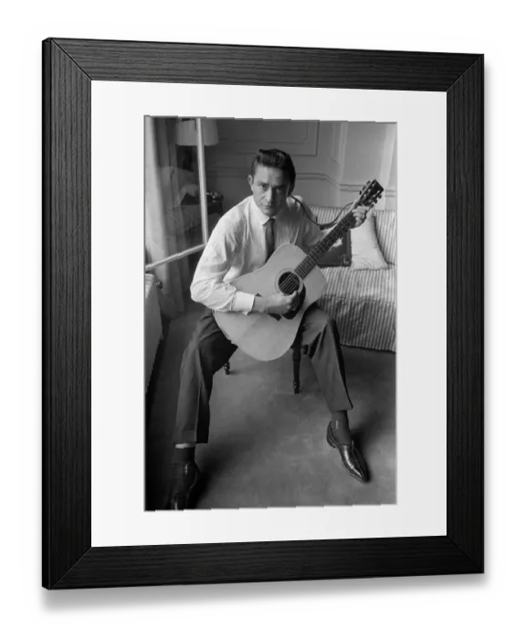 Framed Print : American country singer and musician Johnny Cash poses for photographers at the Savoy