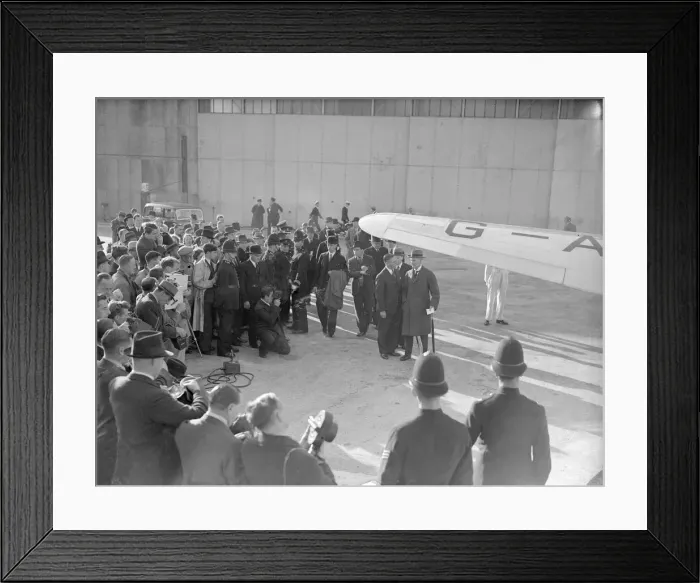 Framed Print : British Prime Minister Neville Chamberlain speaks with a German Embassy official as he Framed Print : British Prime Minister Neville Chamberlain speaks with a German Embassy official as he