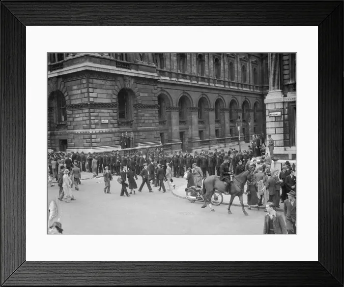 Framed Print : Lines of policemen guard the entrance to Downing Street after the return of British Prime Framed Print : Lines of policemen guard the entrance to Downing Street after the return of British Prime