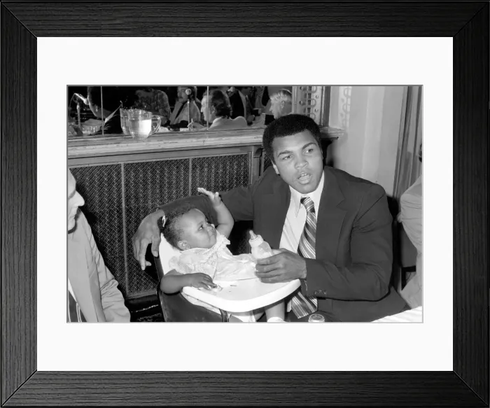 Framed Print : Cassius Clay. Muhammad Ali and daughter Hannah. Ali has baby sitter problems Framed Print : Cassius Clay. Muhammad Ali and daughter Hannah. Ali has baby sitter problems
