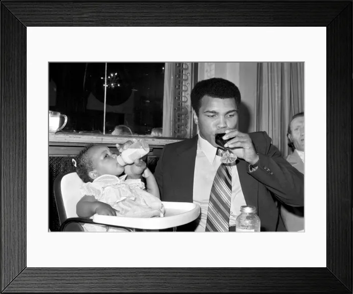 Framed Print : Cassius Clay. Muhammad Ali and daughter Hannah. Ali has baby sitter problems Framed Print : Cassius Clay. Muhammad Ali and daughter Hannah. Ali has baby sitter problems