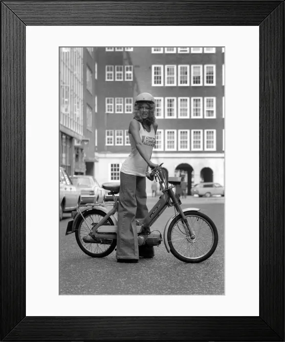 Framed Print : Publicity Dept: Girl on Bicycle. September 1975 75-04942-002