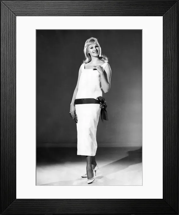 Framed Print : Reveille Fashions 1964: Jo Waring modeling a summer dress with belted detail