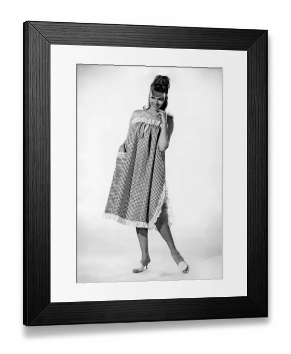 Framed Print : Reveille Fashions: Jo Waring. wearing a three quarters length night dress