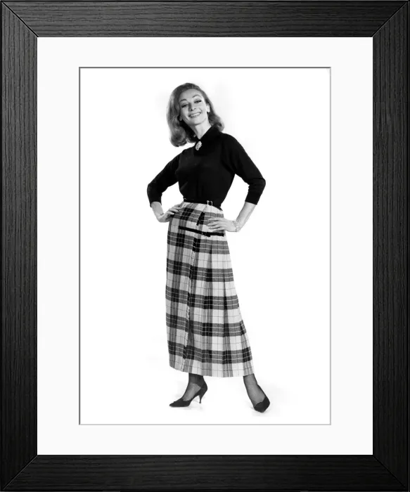 Framed Print : Reveille Fashions 1964. Mannequin modeling a blouse and full length tartan skirt Framed Print : Reveille Fashions 1964. Mannequin modeling a blouse and full length tartan skirt