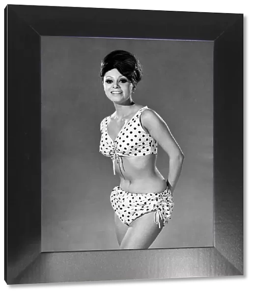 Reveille Fashions 1964: Carmen Dine modeling a polka dot bikini. June 1964 P007548