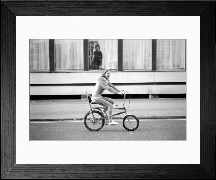 Framed Print : Bicycle, Chopper, Culture / Icon. Model Susan Sayer riding on bike Framed Print : Bicycle, Chopper, Culture / Icon. Model Susan Sayer riding on bike