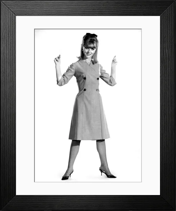 Framed Print : Reveille Fashions 1964: Ann Roberts modeling a double breasted coat September 1964 Framed Print : Reveille Fashions 1964: Ann Roberts modeling a double breasted coat September 1964