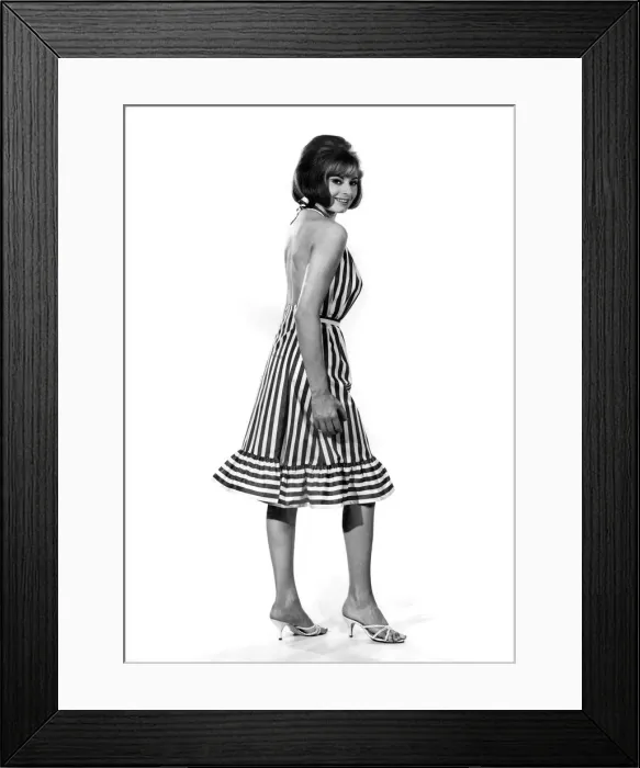 Framed Print : Reveille Fashions 1964: Margaret Loraine modeling a striped summer dress Framed Print : Reveille Fashions 1964: Margaret Loraine modeling a striped summer dress
