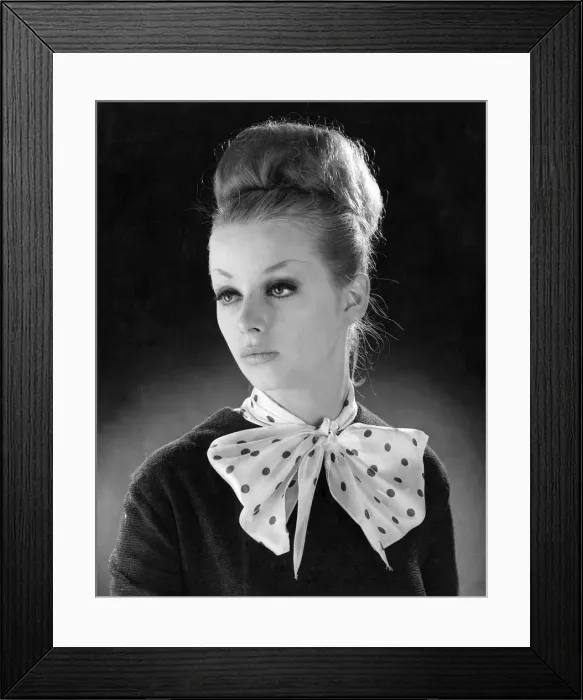 Framed Print : Reveille Fashions. Mannequinn modeling a scarf tied into a bow. January 1964 P007553