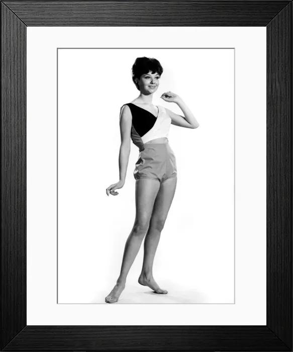 Framed Print : Reveille Fashions: Meriel Weston modeling a beach suit consisting of a bra top and shorts