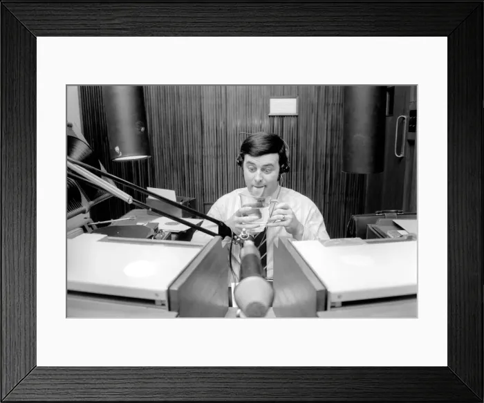 Framed Print : Disc Jockey Terry Wogan enjoys a large jug of water during broadcast of his afternoon Framed Print : Disc Jockey Terry Wogan enjoys a large jug of water during broadcast of his afternoon