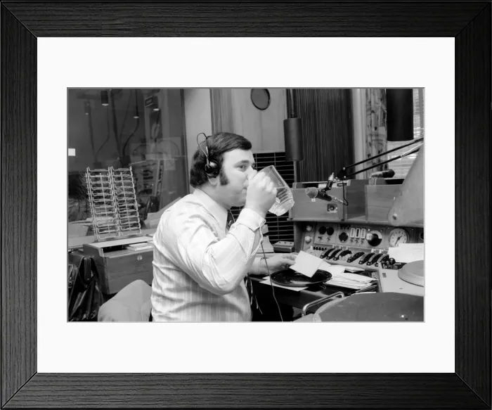 Framed Print : Disc Jockey Terry Wogan enjoys a large jug of water during broadcast of his afternoon Framed Print : Disc Jockey Terry Wogan enjoys a large jug of water during broadcast of his afternoon