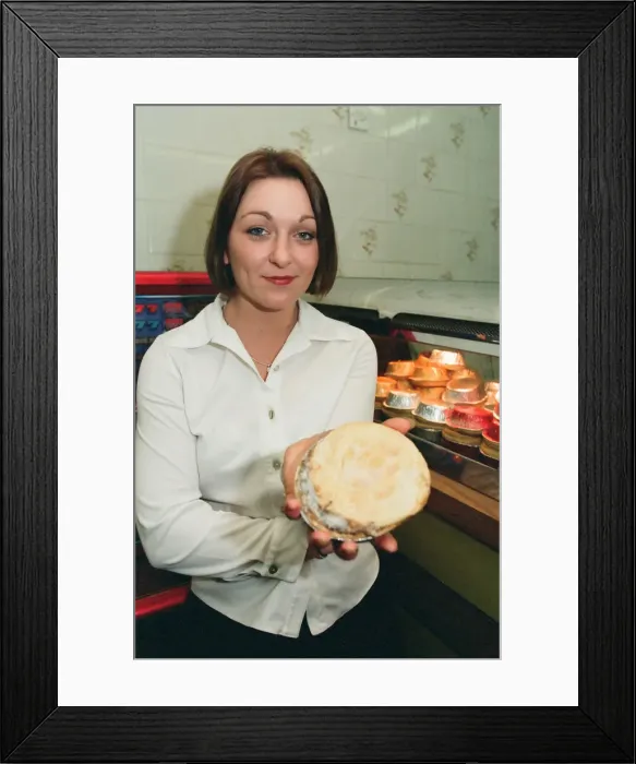 Framed Print : 21 year old barmaid Sarah Pilcher holds up a steak and kidney pie in a fish and chip shop Framed Print : 21 year old barmaid Sarah Pilcher holds up a steak and kidney pie in a fish and chip shop