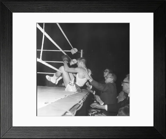 Framed Print : Ralph Ungricht gets a helping hand from the ringside reporters after being knocked out of Framed Print : Ralph Ungricht gets a helping hand from the ringside reporters after being knocked out of