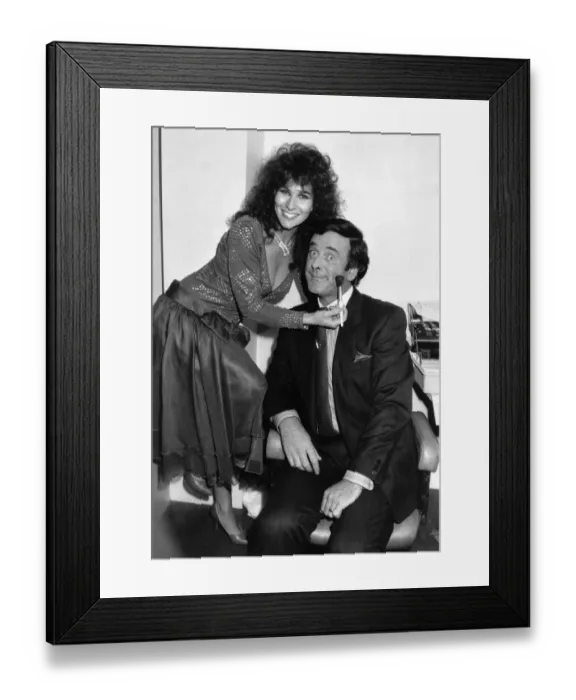 Framed Print : Glamour model Linda Lusardi applies some last minute makeup to Terry Wogan presenter of