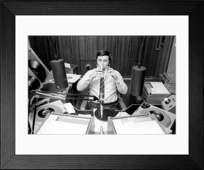 Framed Print : Disc Jockey Terry Wogan enjoys a large jug of water during broadcast of his afternoon Framed Print : Disc Jockey Terry Wogan enjoys a large jug of water during broadcast of his afternoon