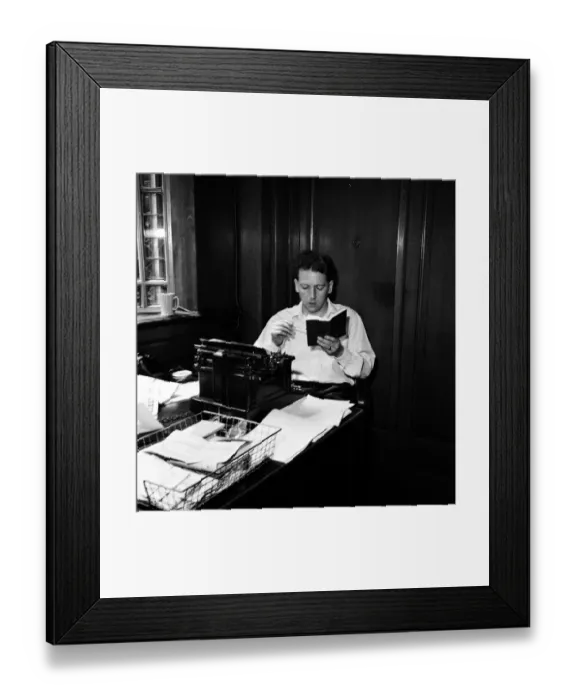 Framed Print : Keith Waterhouse Daily Mirror Newspaper Columnist, pictured at his desk July 1957 Framed Print : Keith Waterhouse Daily Mirror Newspaper Columnist, pictured at his desk July 1957