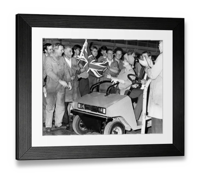 Framed Print : The Queen Mum has a lift in an electric car driven by assembly development manager George