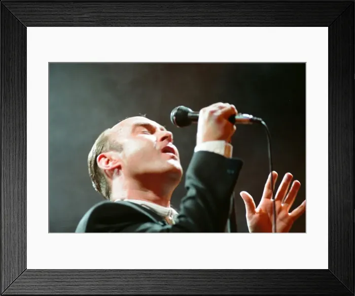Framed Print : British singer Phil Collins performing on stage during a concert in Britain Framed Print : British singer Phil Collins performing on stage during a concert in Britain