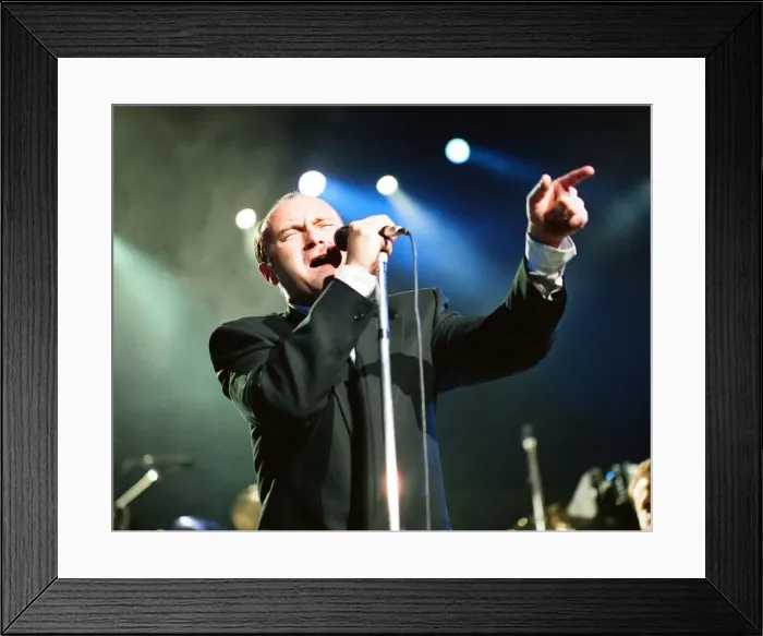 Framed Print : British singer Phil Collins performing on stage during a concert in Britain Framed Print : British singer Phil Collins performing on stage during a concert in Britain