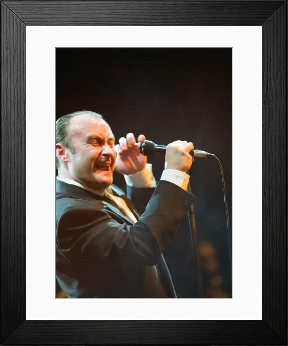 Framed Print : British singer Phil Collins performing on stage during a concert in Britain Framed Print : British singer Phil Collins performing on stage during a concert in Britain