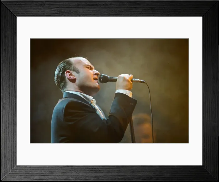 Framed Print : British singer Phil Collins performing on stage during a concert in Britain Framed Print : British singer Phil Collins performing on stage during a concert in Britain
