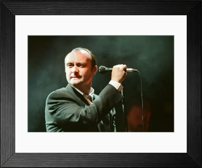 Framed Print : British singer Phil Collins performing on stage during a concert in Britain Framed Print : British singer Phil Collins performing on stage during a concert in Britain