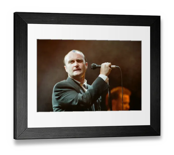 Framed Print : British singer Phil Collins performing on stage during a concert in Britain