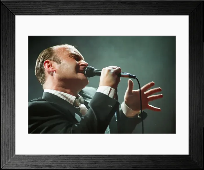 Framed Print : British singer Phil Collins performing on stage during a concert in Britain Framed Print : British singer Phil Collins performing on stage during a concert in Britain