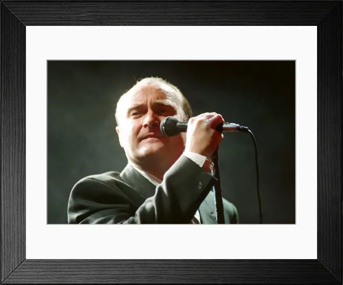 Framed Print : British singer Phil Collins performing on stage during a concert in Britain Framed Print : British singer Phil Collins performing on stage during a concert in Britain