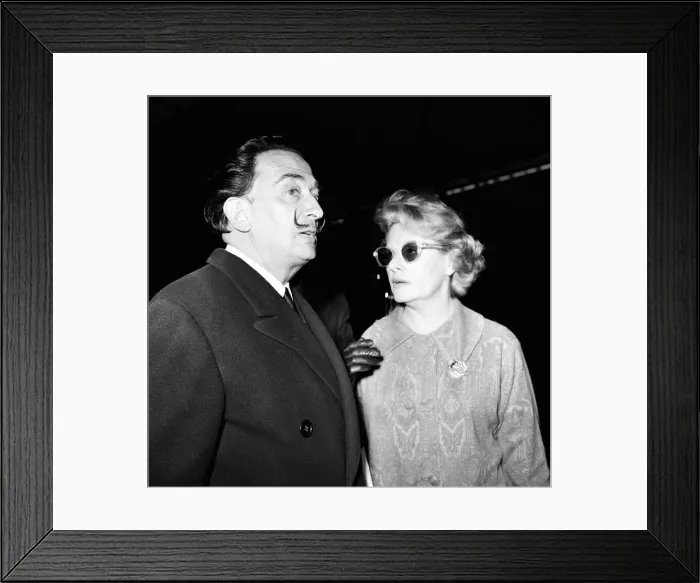 Framed Print : Artist Salvador Dali arrives in the UK, on the continental boat train to promote his Framed Print : Artist Salvador Dali arrives in the UK, on the continental boat train to promote his