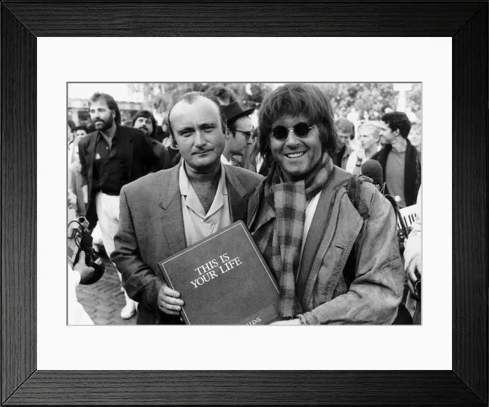 Framed Print : Singer Phil Collins is surprised by This Is Your Life presenter Michael Aspell Framed Print : Singer Phil Collins is surprised by This Is Your Life presenter Michael Aspell