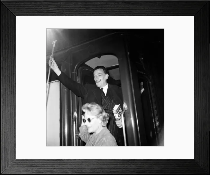Framed Print : Artist Salvador Dali arrives in the UK, on the continental boat train to promote his Framed Print : Artist Salvador Dali arrives in the UK, on the continental boat train to promote his