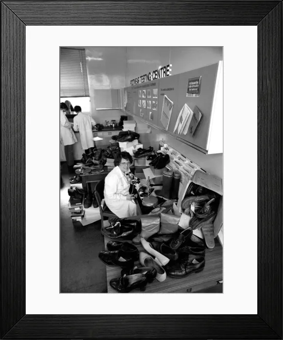 Framed Print : The Shoe Tester: Mrs. Isobel Bingham is a Shoe Inspector employed by the Footwear Testing Framed Print : The Shoe Tester: Mrs. Isobel Bingham is a Shoe Inspector employed by the Footwear Testing